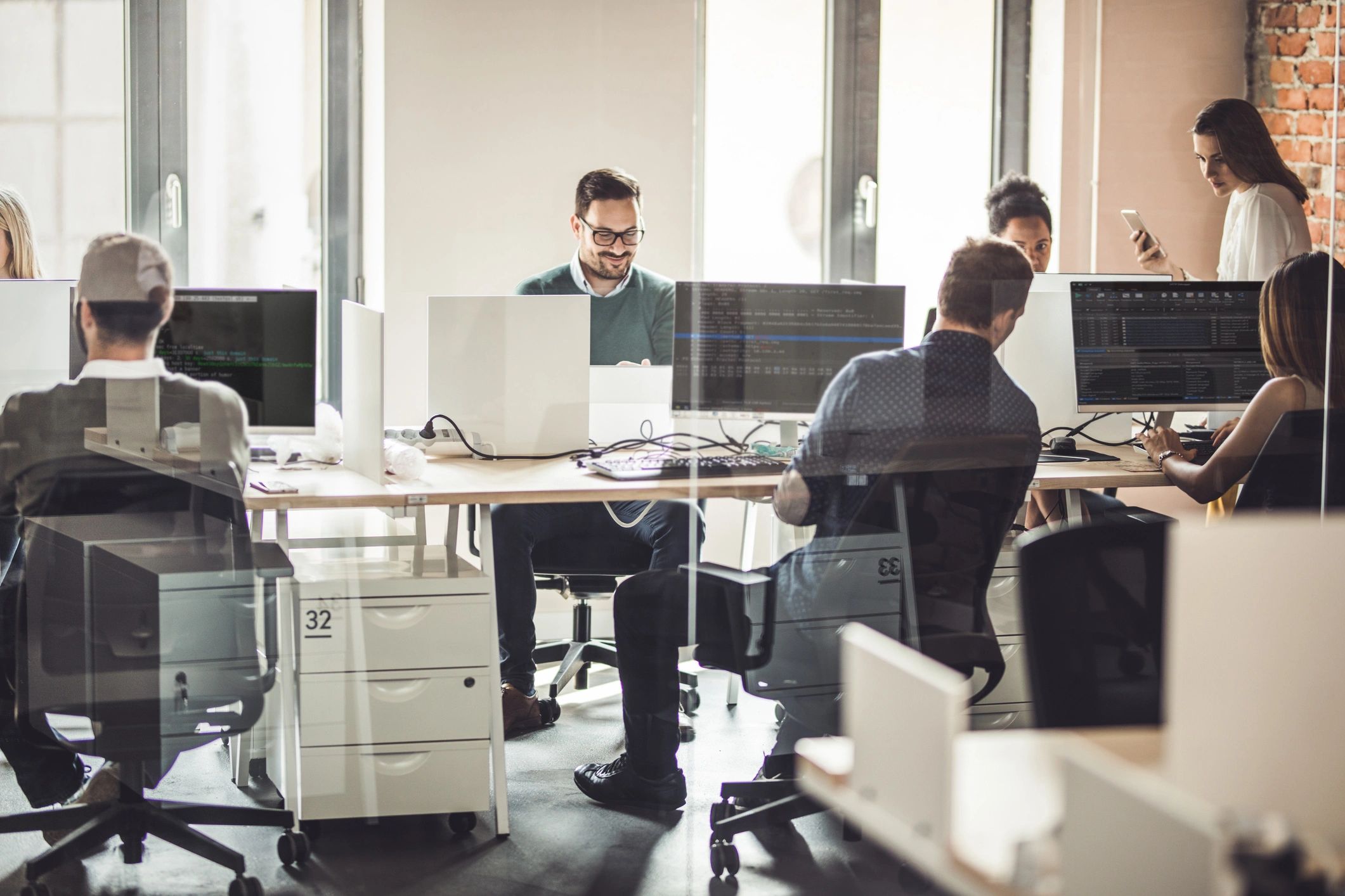 Technology professionals collaborating in an office