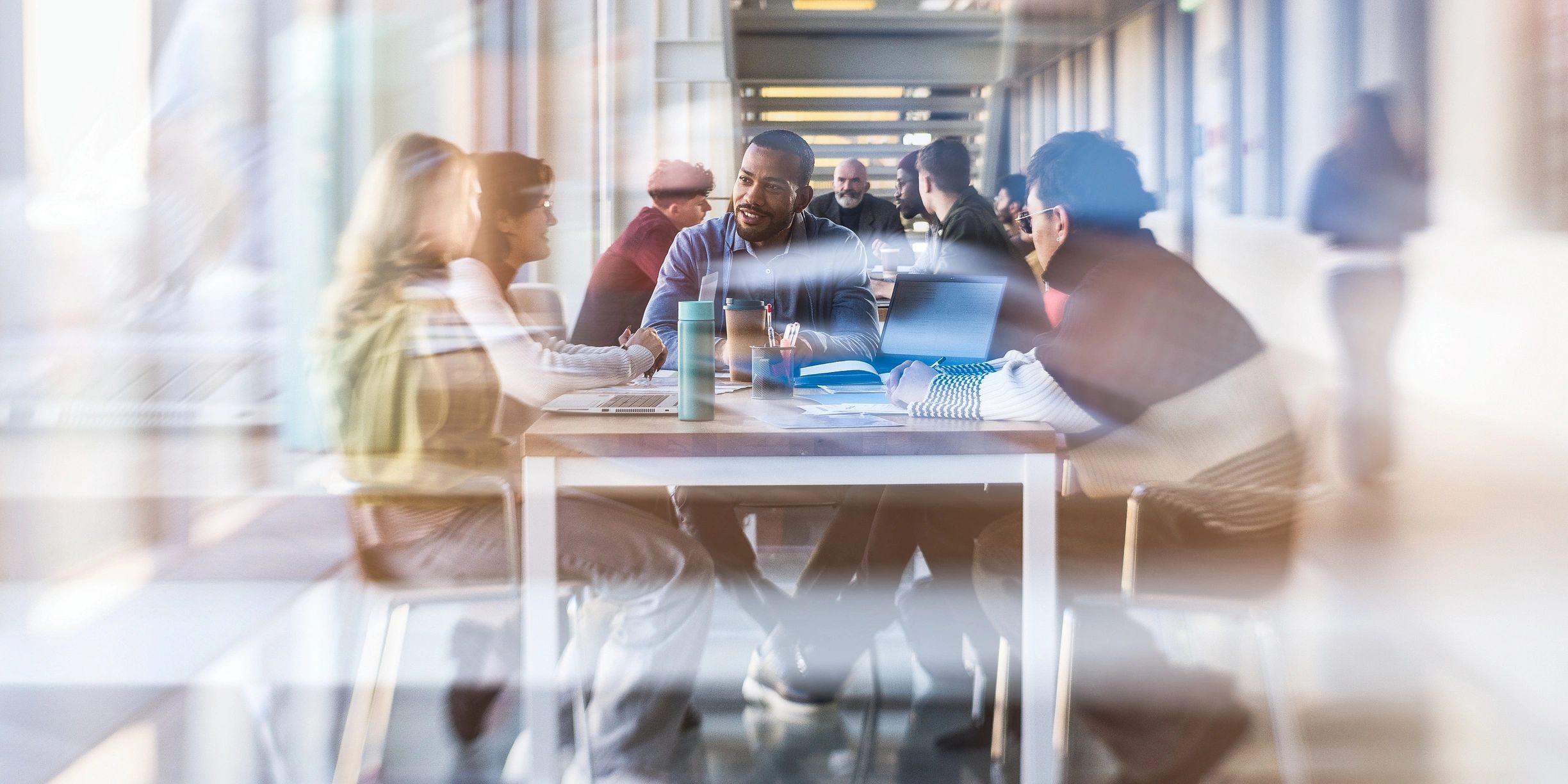 Professionals collaborating in a public-sector office meeting