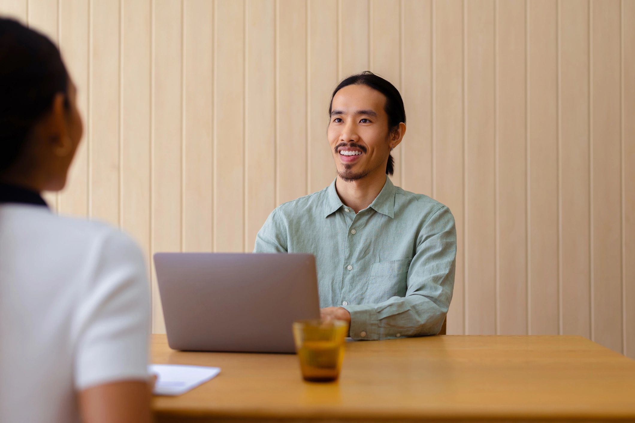Consultant meeting with a candidate in a professional office